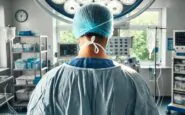 dalle 2024 11 14 132141 a skilled surgeon standing in an operating room viewed from behind wearing a surgical gown gloves and a mask the surgeon is focused on the patien